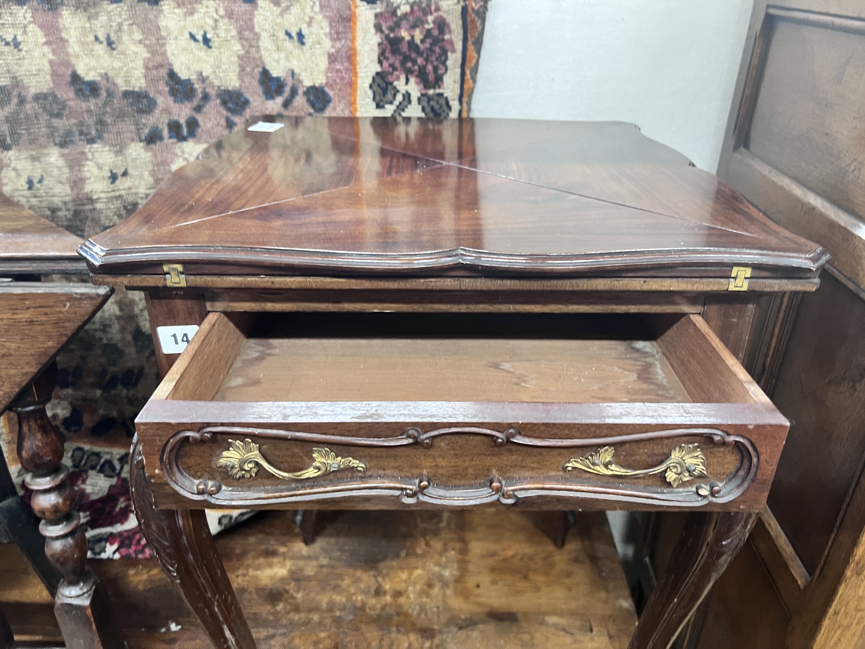 A late Victorian mahogany envelope card table, width 51cm, depth 51cm, height 75cm